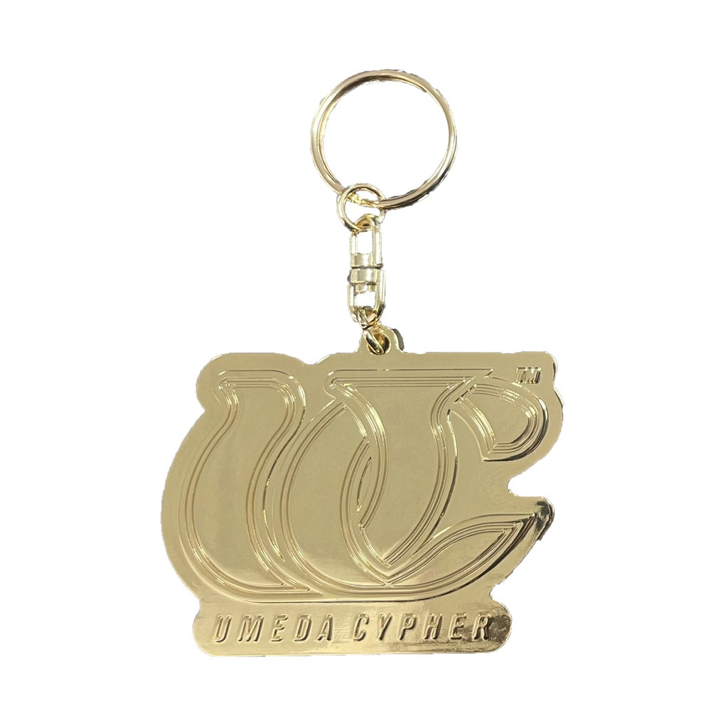 NEW LOGO METAL KEYCHAIN [GOLD] – UMEDACYPHER OFFICIAL GOODS